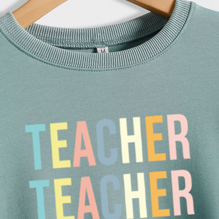 Pull à manches longues pour femme avec lettre d'enseignant et col rond imprimé